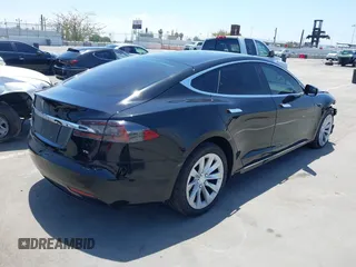 2017 Tesla Model S 60 with VIN 5YJSA1E17HF232699, listed as a IAAI auction lot 42327539 with 113,923 mi miles and . Bid and sale history available at DreamBid. Image 4.