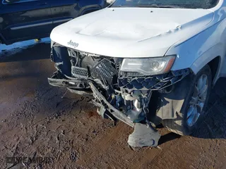 2014 Jeep Grand Cherokee Summit with VIN 1C4RJFJT4EC500362, listed as a IAAI auction lot 41332347 with 159,197 mi miles. Bid and sale history available at carsss.com. Image 6.
