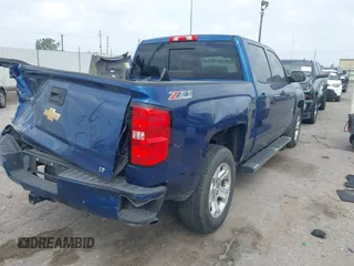 2017 Chevrolet Silverado 1500 LT with VIN 3GCUKREC8HG462719, listed as a IAAI auction lot 41940176 with 380,676 mi miles and . Bid and sale history available at DreamBid. Image 4.