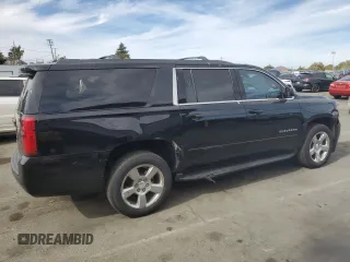 2019 Chevrolet Suburban LS z VIN 1GNSCGKC2KR297407, wystawiony jako Copart lot #75224194 z przebiegiem 93 562 mil mil oraz Szkoda całkowita • Salvage title. Historia ofert i sprzedaży dostępna na DreamBid. Obrazek 3.