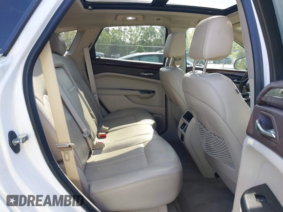 2013 Cadillac SRX Luxury Collection with VIN 3GYFNCE33DS608040, listed as a IAAI auction lot 41912860 with 128,295 mi miles and . Bid and sale history available at DreamBid. Image 8.