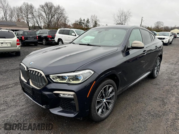 2021 BMW X6 M50i z VIN 5UXCY8C02M9D95172, wystawiony jako Copart lot #84796854 z przebiegiem 75 299 mil mil oraz Czysty tytuł • Clean title. Historia ofert i sprzedaży dostępna na DreamBid. Obrazek 1.