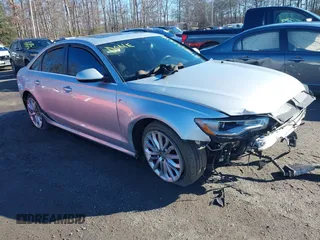 2014 Audi A6 3.0T Prestige with VIN WAUHGAFC9EN101728, listed as a IAAI auction lot 41077354 with 60,485 mi miles. Bid and sale history available at carsss.com. Image 1.