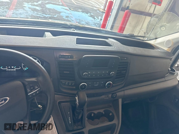2023 Ford Transit Cargo with VIN 1FTBR1X86PKC09421, listed as a IAAI auction lot 42843981 with 10,233 mi miles and . Bid and sale history available at DreamBid. Image 20.