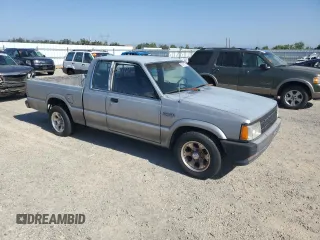 1993 Mazda B-Series Truck z VIN JM2UF3130P0378304, wystawiony jako Copart lot #58799925 z przebiegiem 132 801 mil mil oraz Szkoda całkowita • Salvage title. Historia ofert i sprzedaży dostępna na DreamBid. Obrazek 4.