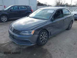 2016 Volkswagen Jetta Sedan 1.4T SE with VIN 3VWD67AJ7GM281671, listed as a IAAI auction lot 41385896 with 153,168 mi miles. Bid and sale history available at carsss.com. Image 2.