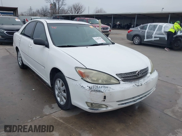 2003 Toyota Camry LE z VIN JTDBF30K530148403, wystawiony jako IAAI lot #41688346 z przebiegiem 299 143 mil mil oraz . Historia ofert i sprzedaży dostępna na DreamBid. Obrazek 1.