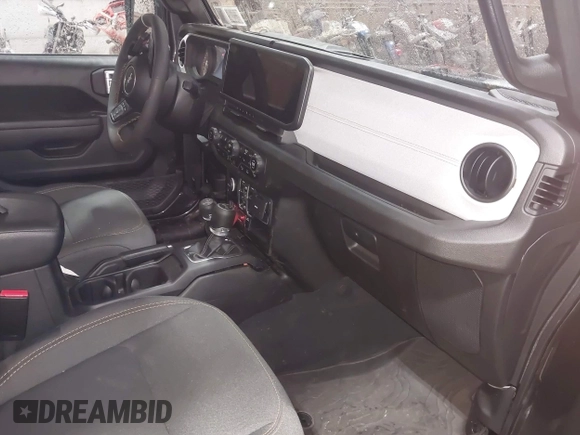 2024 Jeep Wrangler Sport S with VIN 1C4RJXN64RW162895, listed as a IAAI auction lot 42217515 with 8,442 mi miles and . Bid and sale history available at DreamBid. Image 5.