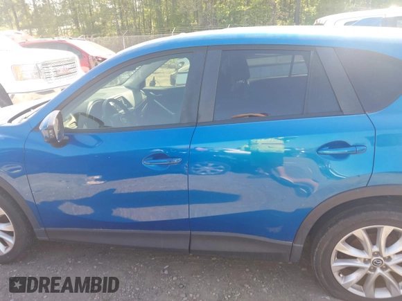 2013 Mazda CX-5 Grand Touring with VIN JM3KE2DEXD0123314, listed as a IAAI auction lot 42064266 with 288,935 mi miles. Bid and sale history available at carsss.com. Image 14.