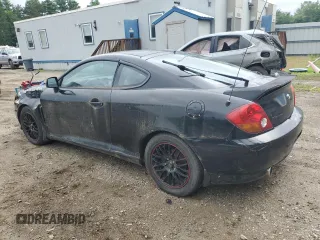 2003 Hyundai Tiburon GT z VIN KMHHN65F83U101784, wystawiony jako Copart lot #41566805 z przebiegiem 99 970 mil mil oraz Nie do naprawy • Non repairable. Historia ofert i sprzedaży dostępna na DreamBid. Obrazek 2.