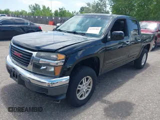 2011 GMC Canyon SLE1 z VIN 1GTH6MFE8B8112755, wystawiony jako IAAI lot #42359366 z przebiegiem 153 905 mil mil oraz . Historia ofert i sprzedaży dostępna na DreamBid. Obrazek 2.