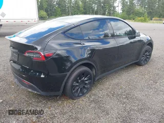 2023 Tesla Model Y Long Range z VIN 7SAYGDEE2PF885116, wystawiony jako IAAI lot #40091902 z przebiegiem 11 779 mil mil oraz . Historia ofert i sprzedaży dostępna na DreamBid. Obrazek 4.