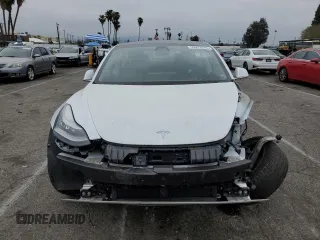 2020 Tesla Model 3 Standard Range Plus with VIN 5YJ3E1EA5LF747010, listed as a Copart auction lot 50937975 with Not Provided miles and Salvage Title. Bid and sale history available at DreamBid. Image 5.