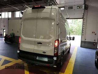 2023 Ford Transit Cargo with VIN 1FTBR1X85PKC00581, listed as a IAAI auction lot 42842410 with 8,386 mi miles and . Bid and sale history available at DreamBid. Image 1.