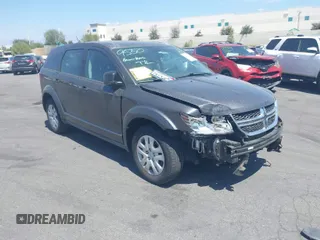 2015 Dodge Journey American Value Pkg with VIN 3C4PDCAB7FT556919, listed as a IAAI auction lot 42087599 with 100,574 mi miles. Bid and sale history available at carsss.com. Image 1.