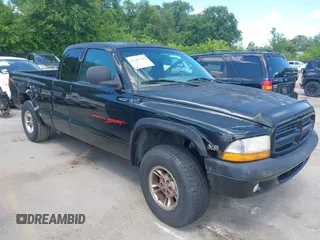 1999 Dodge Dakota SLT z VIN 1B7GG22YXXS304489, wystawiony jako IAAI lot #42326703 z przebiegiem 183 490 mil mil oraz . Historia ofert i sprzedaży dostępna na DreamBid. Obrazek 1.
