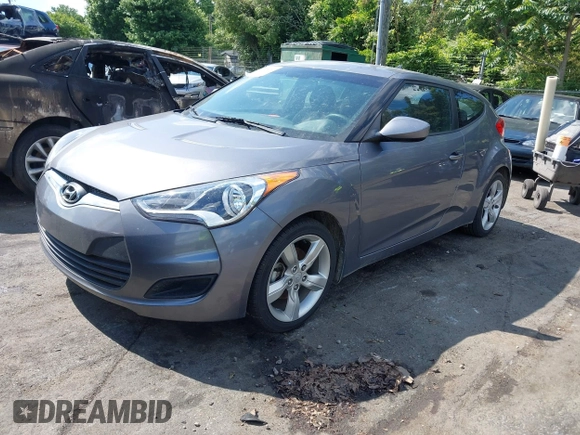 2013 Hyundai Veloster w/Gray Int with VIN KMHTC6ADXDU172104, listed as a IAAI auction lot 42198689 with 67,160 mi miles and . Bid and sale history available at DreamBid. Image 2.
