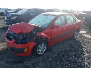 2009 Kia Rio LX with VIN KNADE223796485606, listed as a IAAI auction lot 41676881 with 58,852 mi miles and . Bid and sale history available at DreamBid. Image 2.