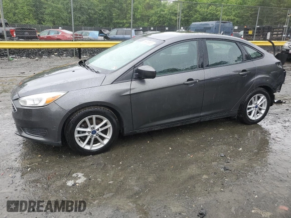 2018 Ford Focus SE z VIN 1FADP3F21JL285417, wystawiony jako Copart lot #56936965 z przebiegiem Nie podano mil oraz Czysty tytuł • Clean title. Historia ofert i sprzedaży dostępna na DreamBid. Obrazek 1.