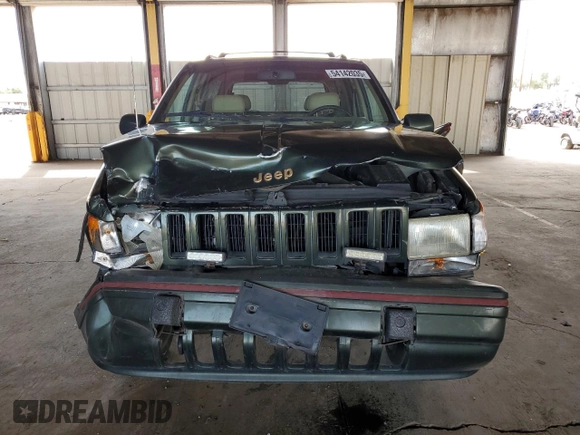 1995 Jeep Grand Cherokee Limited with VIN 1J4GZ78Y2SC723898, listed as a Copart auction lot 54142035 with 173,454 mi miles and Salvage Title. Bid and sale history available at carsss.com. Image 5.