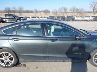 2016 Ford Fusion Titanium Hybrid with VIN 3FA6P0RU6GR156622, listed as a IAAI auction lot 41178887 with 92,423 mi miles. Bid and sale history available at carsss.com. Image 14.
