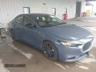 2023 Mazda 3 S Carbon Edition with VIN 3MZBPBCM2PM360213, listed as a IAAI auction lot 42567904 with 50,390 mi miles and . Bid and sale history available at DreamBid. Image 1.