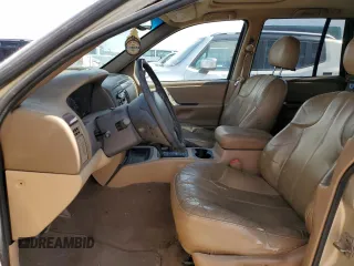 2000 Jeep Grand Cherokee Laredo with VIN 1J4GW48S6YC304447, listed as a Copart auction lot 58001035 with Not provided miles and Clean title. Bid and sale history available at DreamBid. Image 7.