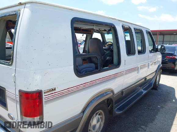 1999 Ford Econoline Cargo Recreational with VIN 1FDRE14L2XHA41059, listed as a IAAI auction lot 42067879 with 149,185 mi miles. Bid and sale history available at carsss.com. Image 20.