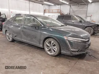 2018 Honda Clarity Touring z VIN JHMZC5F39JC002521, wystawiony jako IAAI lot #41428968 z przebiegiem 64 014 mil mil oraz . Historia ofert i sprzedaży dostępna na DreamBid. Obrazek 1.