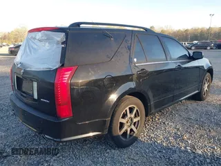 2004 Cadillac SRX with VIN 1GYDE63A040116714, listed as a IAAI auction lot 41828311 with 128,372 mi miles. Bid and sale history available at carsss.com. Image 4.