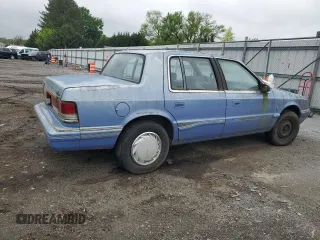1991 Plymouth Acclaim z VIN 1P3XA4633MF523214, wystawiony jako Copart lot #55908665 z przebiegiem 90 332 mil mil oraz Tytuł czysty. Historia ofert i sprzedaży dostępna na DreamBid. Obrazek 3.