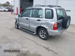 2001 Chevrolet Tracker LT z VIN 2CNBJ634916959876, wystawiony jako IAAI lot #42166992 z przebiegiem 97 878 mil mil oraz . Historia ofert i sprzedaży dostępna na DreamBid. Obrazek 3.