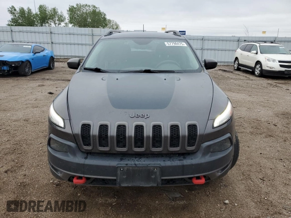 2015 Jeep Cherokee Trailhawk with VIN 1C4PJMBB6FW574108, listed as a Copart auction lot 57798475 with 105,022 mi miles and Salvage title. Bid and sale history available at DreamBid. Image 5.