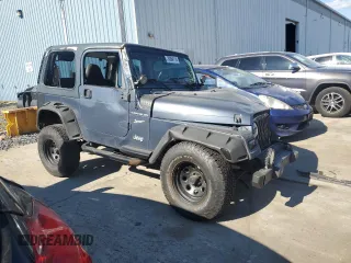 2002 Jeep Wrangler Sport with VIN 1J4FA49S72P715946, listed as a Copart auction lot 70884114 with 114,964 mi miles and Clean Title. Bid and sale history available at carsss.com. Image 4.