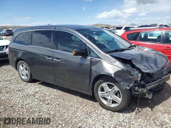 2012 Honda Odyssey Touring with VIN 5FNRL5H97CB070213, listed as a Copart auction lot 53558715 with 218,964 mi miles and Salvage title. Bid and sale history available at DreamBid. Image 4.