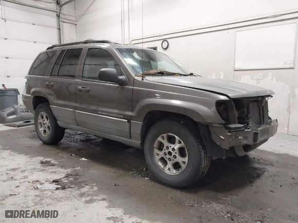 1999 Jeep Grand Cherokee Laredo with VIN 1J4GW58SXXC584734, listed as a IAAI auction lot 41902224 with 209,180 mi miles. Bid and sale history available at carsss.com. Image 1.