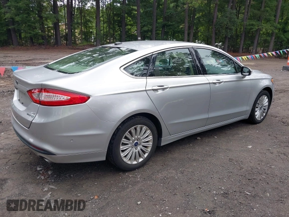 2013 Ford Fusion SE Hybrid z VIN 3FA6P0LU1DR291060, wystawiony jako IAAI lot #42731674 z przebiegiem 93 918 mil mil oraz . Historia ofert i sprzedaży dostępna na DreamBid. Obrazek 4.