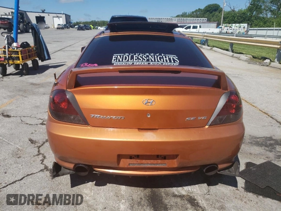 2006 Hyundai Tiburon GT z VIN KMHHN65F66U191134, wystawiony jako Copart lot #56692615 z przebiegiem 197 093 mil mil oraz Szkoda całkowita • Salvage title. Historia ofert i sprzedaży dostępna na DreamBid. Obrazek 6.