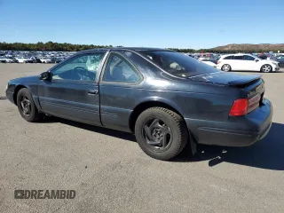 1997 Ford Thunderbird LX z VIN 1FALP62W9VH112212, wystawiony jako Copart lot #75232034 z przebiegiem 138 666 mil mil oraz Szkoda całkowita • Salvage title. Historia ofert i sprzedaży dostępna na DreamBid. Obrazek 2.