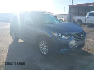 2016 Mazda CX-5 Touring z VIN JM3KE2CY4G0852103, wystawiony jako IAAI lot #41736423 z przebiegiem 120 011 mil mil oraz . Historia ofert i sprzedaży dostępna na DreamBid. Obrazek 1.
