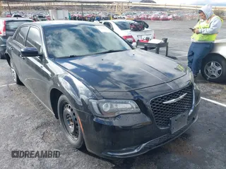 2018 Chrysler 300 with VIN 2C3CCABGXJH239934, listed as a IAAI auction lot 41517944 with 140,699 mi miles. Bid and sale history available at carsss.com. Image 1.