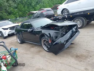 2001 Ford Mustang GT Deluxe z VIN 1FAFP45X11F258695, wystawiony jako IAAI lot #42197786 z przebiegiem 111 778 mil mil oraz . Historia ofert i sprzedaży dostępna na DreamBid. Obrazek 1.