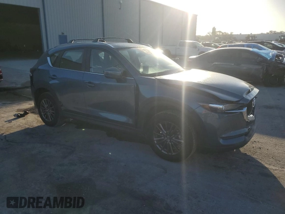 2019 Mazda CX-5 Sport with VIN JM3KFABM5K0676032, listed as a Copart auction lot 52067605 with 59,574 mi miles and Salvage Title. Bid and sale history available at DreamBid. Image 4.