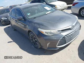 2018 Toyota Avalon XLE z VIN 4T1BK1EB7JU279276, wystawiony jako IAAI lot #41818843 z przebiegiem 156 837 mil mil oraz . Historia ofert i sprzedaży dostępna na DreamBid. Obrazek 1.