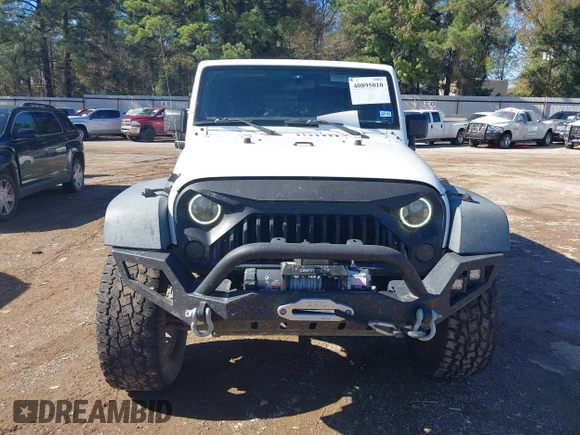2017 Jeep Wrangler Unlimited Sport with VIN 1C4BJWDG4HL502861, listed as a IAAI auction lot 40895010 with 62,970 mi miles. Bid and sale history available at carsss.com. Image 12.