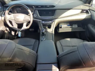 2023 Cadillac XT5 AWD Premium Luxury with VIN 1GYKNDR4XPZ153623, listed as a Copart auction lot 77071324 with 26,292 mi miles and Non Repairable. Bid and sale history available at DreamBid. Image 8.