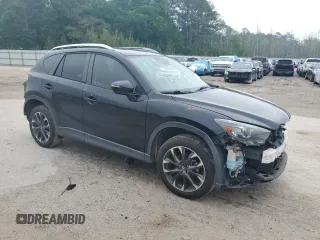 2016 Mazda CX-5 Grand Touring z VIN JM3KE2DY5G0676290, wystawiony jako Copart lot #54155325 z przebiegiem 124 743 mil mil oraz Szkoda całkowita • Salvage title. Historia ofert i sprzedaży dostępna na DreamBid. Obrazek 4.