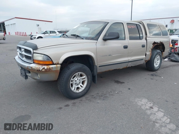 2002 Dodge Dakota SLT z VIN 1B7HG48N32S663205, wystawiony jako IAAI lot #41125874 z przebiegiem 186 761 mil mil oraz . Historia ofert i sprzedaży dostępna na DreamBid. Obrazek 2.