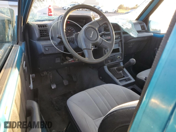 1992 Suzuki Sidekick z VIN 2S3TC01C2N6405497, wystawiony jako Copart lot #75856164 z przebiegiem 38 423 mil mil oraz Szkody całkowita. Historia ofert i sprzedaży dostępna na DreamBid. Obrazek 8.