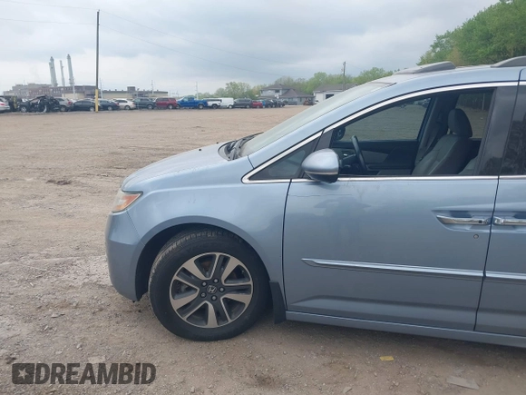 2014 Honda Odyssey Touring with VIN 5FNRL5H91EB081811, listed as a IAAI auction lot 42153920 with 16 mi miles and . Bid and sale history available at DreamBid. Image 14.